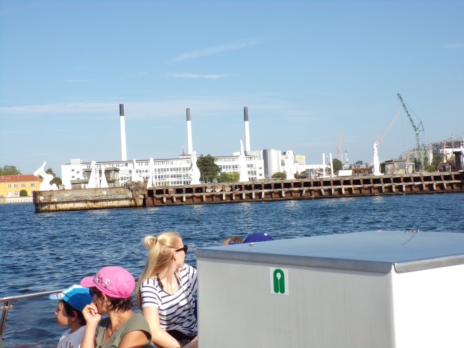 The smoke stacks visible in the background are no longer in use - it was a power plant but Denmark is converting to wind and solar energy.